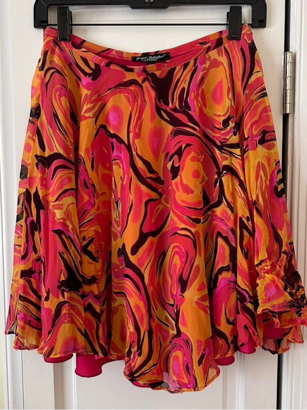 Betsey Johnson black label vibrant orange and pink swirl patterned silk skirt.